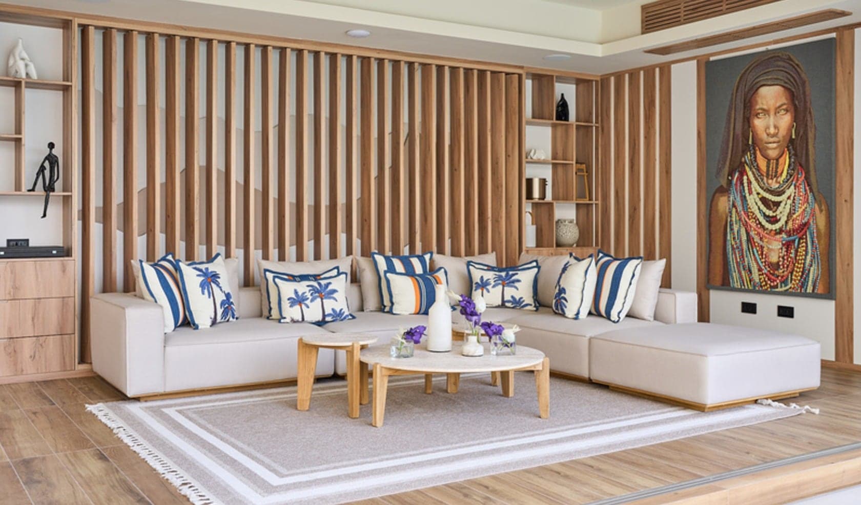 Living room lined with floor-to-ceiling vertical oak slat panelling and display niches